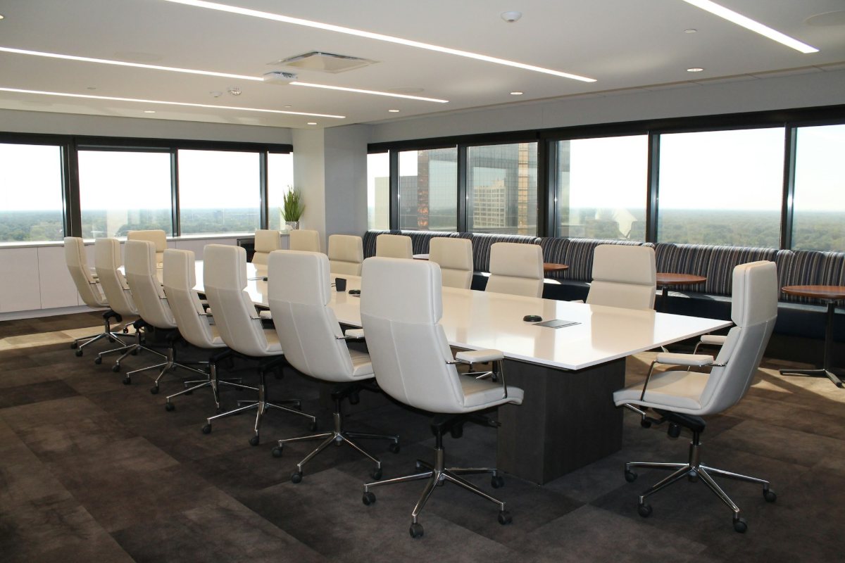 A boardroom table with chairs