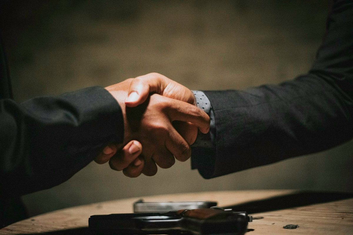 Two business people shaking hands